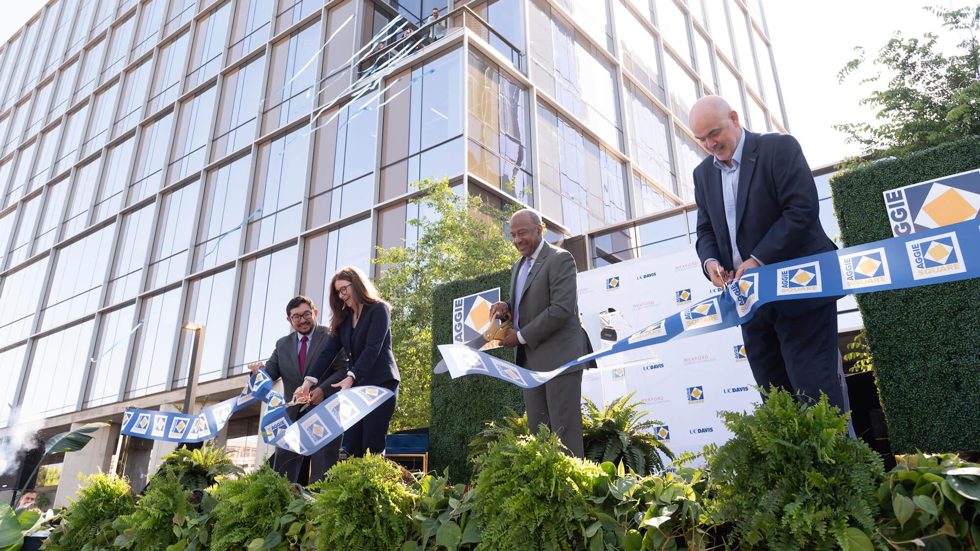 Sacramento Mayor Pro Tem Eric Guerra; Claire Drummond, Vice President for Development, Wexford Science & Technology; UC Davis Chancellor Gary S. May; and UC Davis Chief Innovation and Economic Development Officer George Baxter formally cut the ribbon to inaugurate Aggie Square