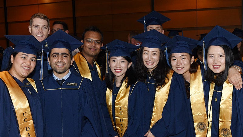 Several students from the Graduate School of management in an informal pose