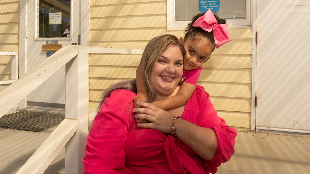 Laicee Brown, with Cienna, her four-year-old daughter, on the steps of the Early Childhood Lab School.