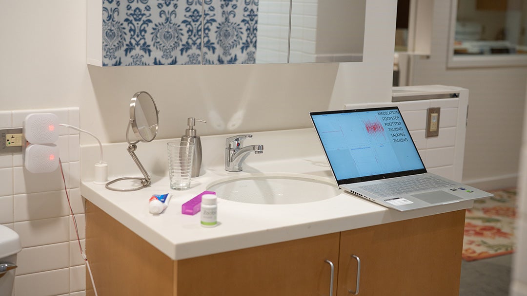 Sensors in use in a bathroom. The readouts are on a laptop computer on the sink.