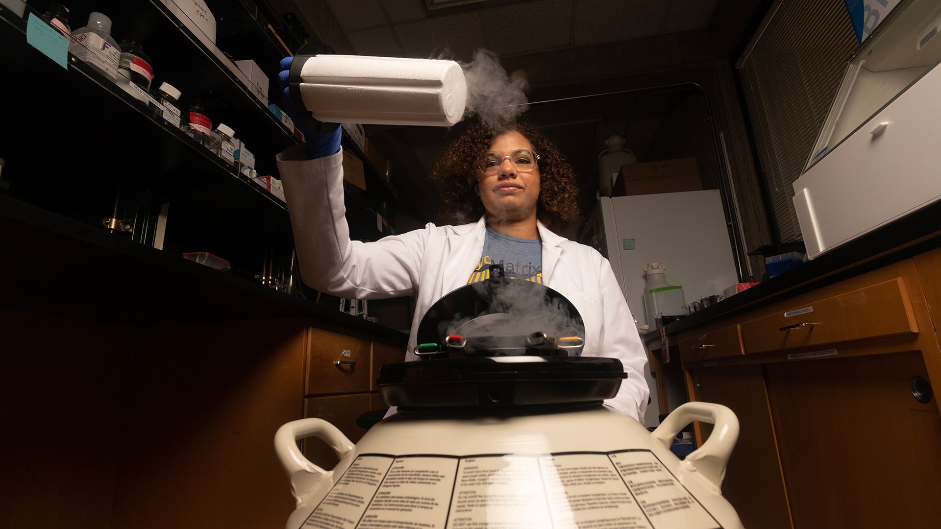 Student in a lab over steaming equipment