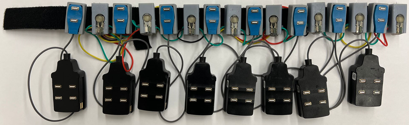 A horizontal band made up of a series of colored squared with a lower band of larger rectangles wired to it.