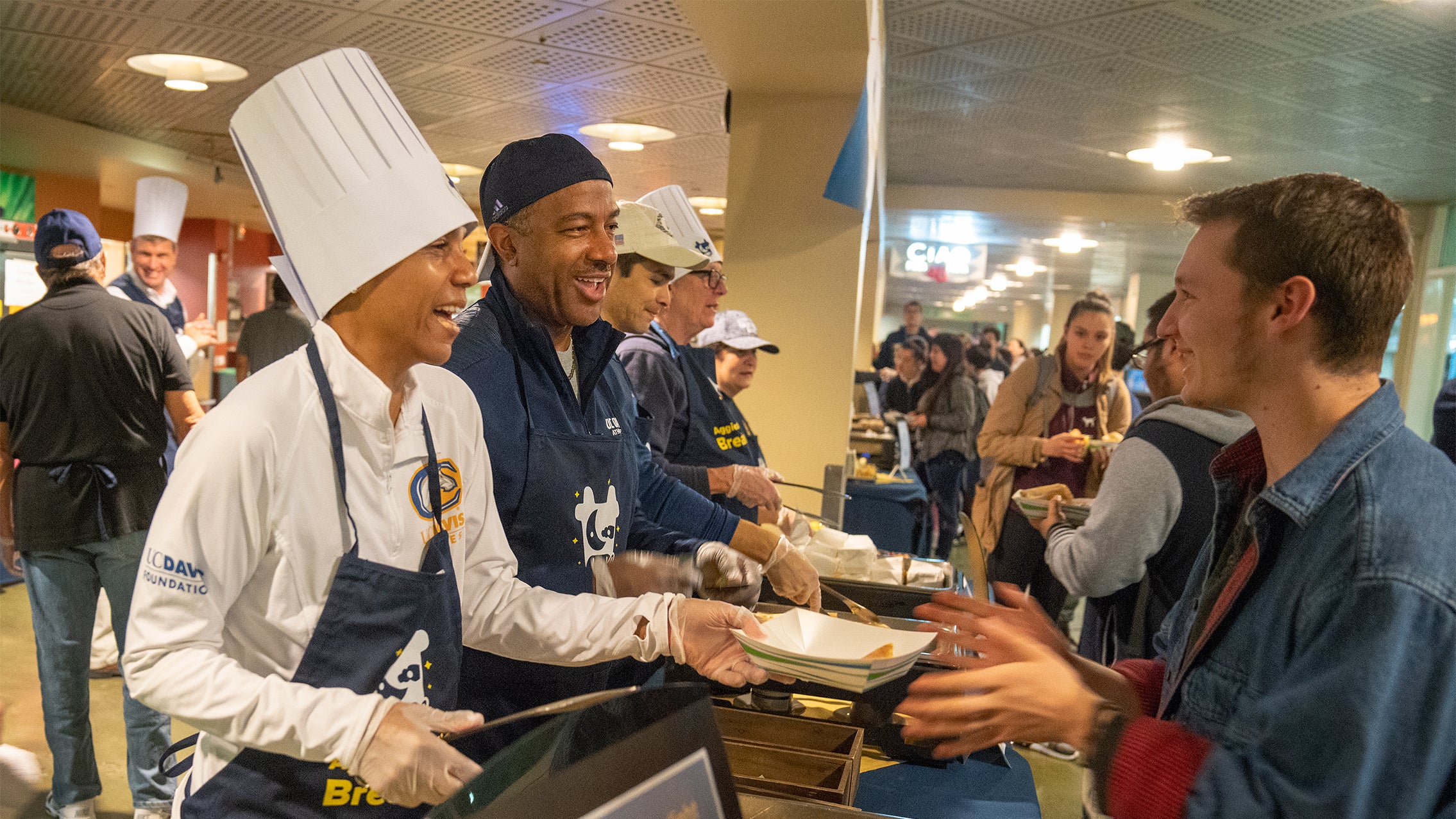 LeShelle May and Chancellor May serve Moonlight Breakfast, December 2018.