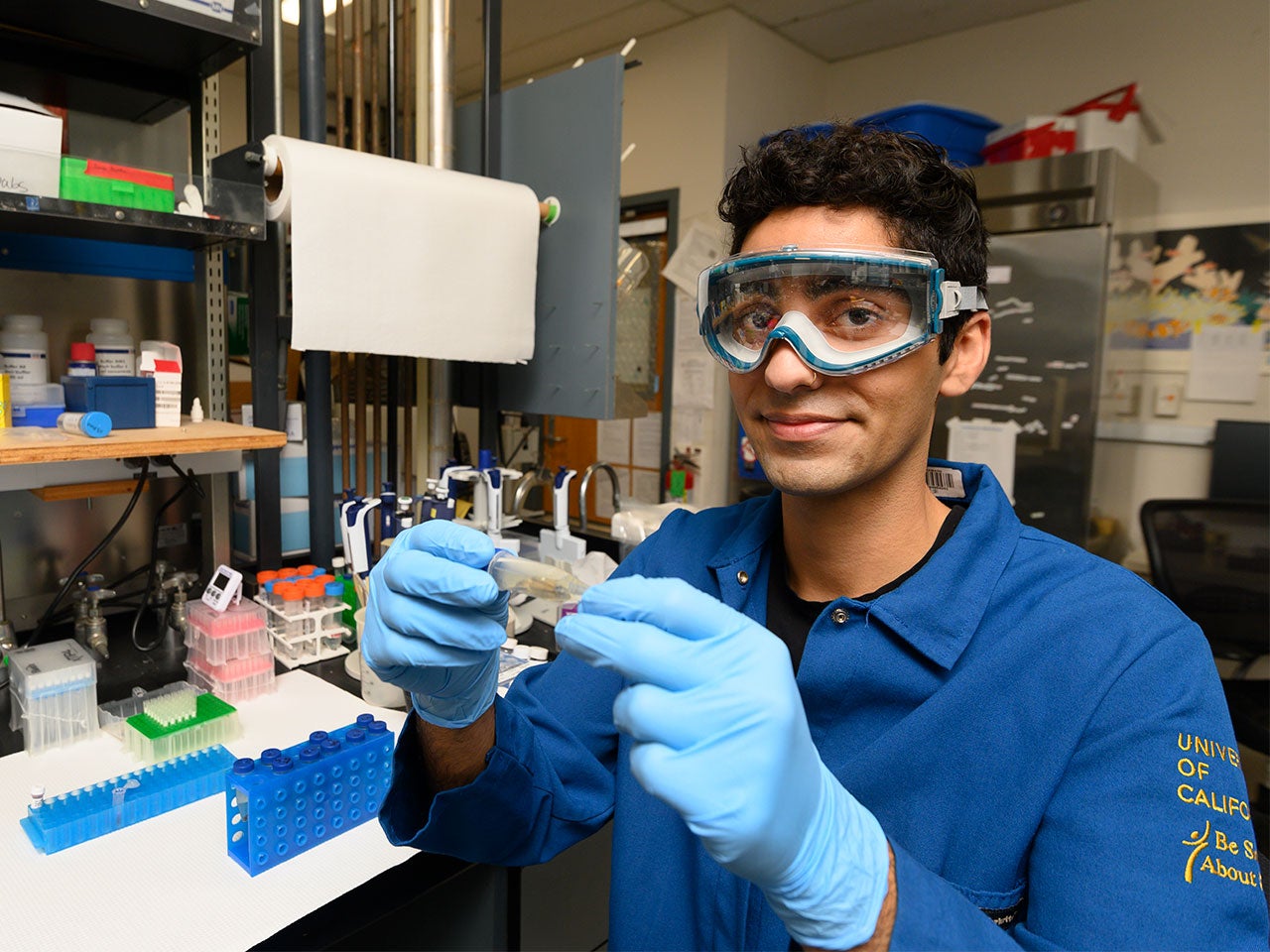 Animal science major Shayan Kaveh is engaged in lab work, showcasing his skills during an internship at UC Davis.