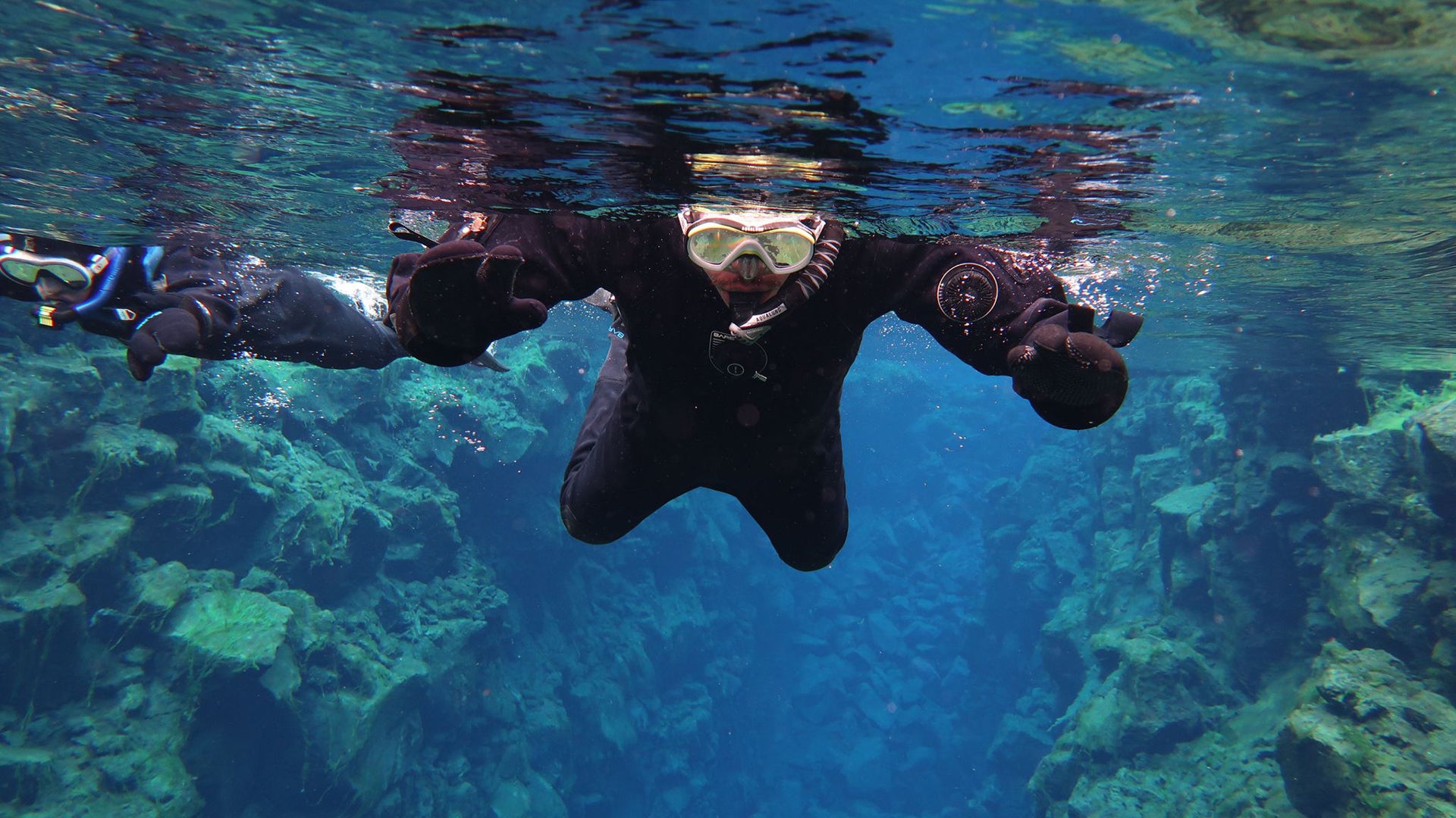 "Snorkeling between the Eurasian and North American Tectonic plate in just above freezing water. The “Silfra Fissure” reaches 100 meters deep and has extremely pure water." (Ali Yavuz Bozatli/ photographer)