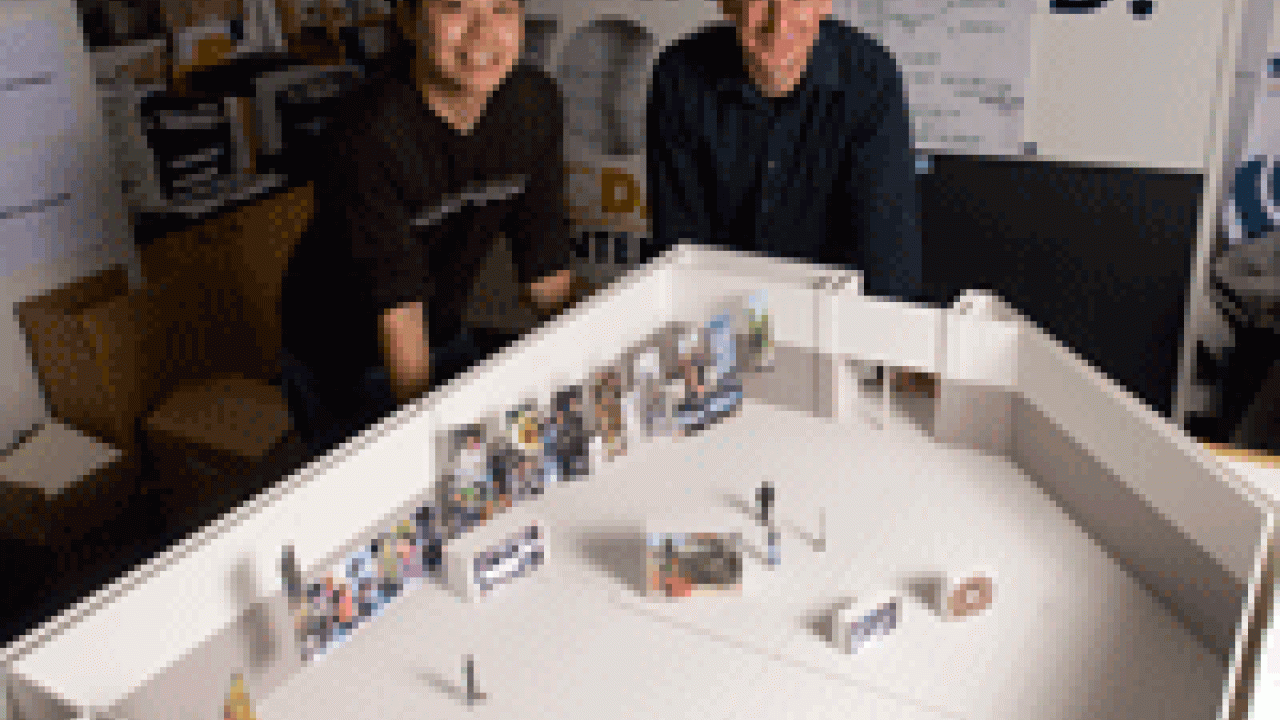 Design Program student Chris Wang, left, built this scale model of a Cal Expo pavilion to help with planning for the UC Davis Centennial exhibition to be housed in the pavilion during the state fair this summer. Also pictured is Assistant Profes