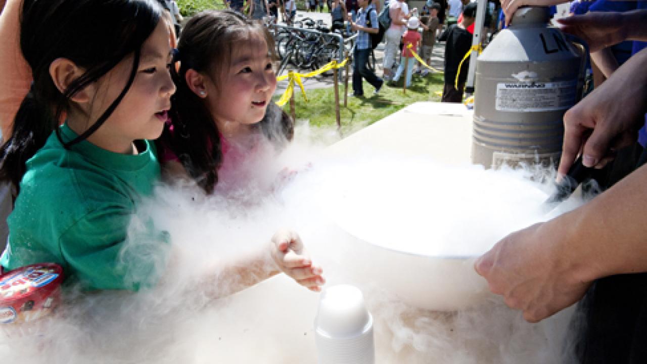 Photo: Linda Yang and Katherin Yu see the power of liquid nitrogen at last year's Picnic Day, when chemistry students made mango sorbet.