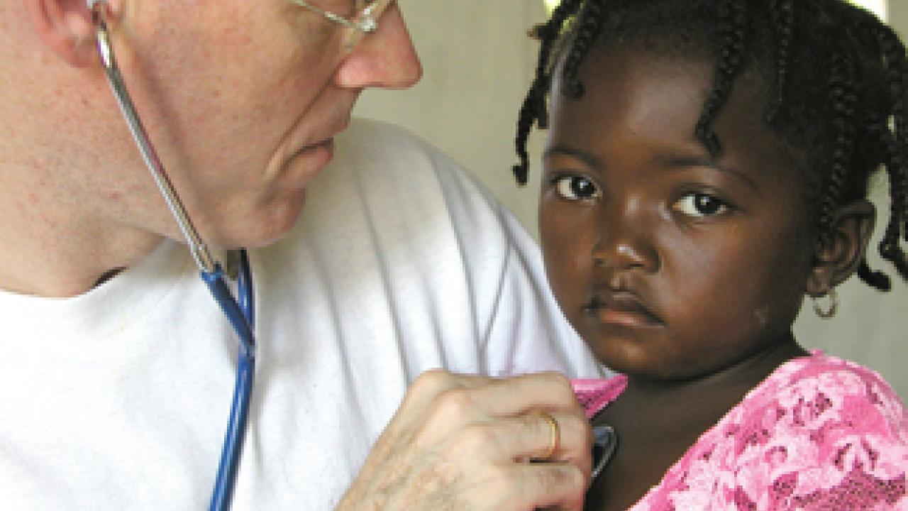 Paul Farmer and an unidentified patient in Haiti in 2001.