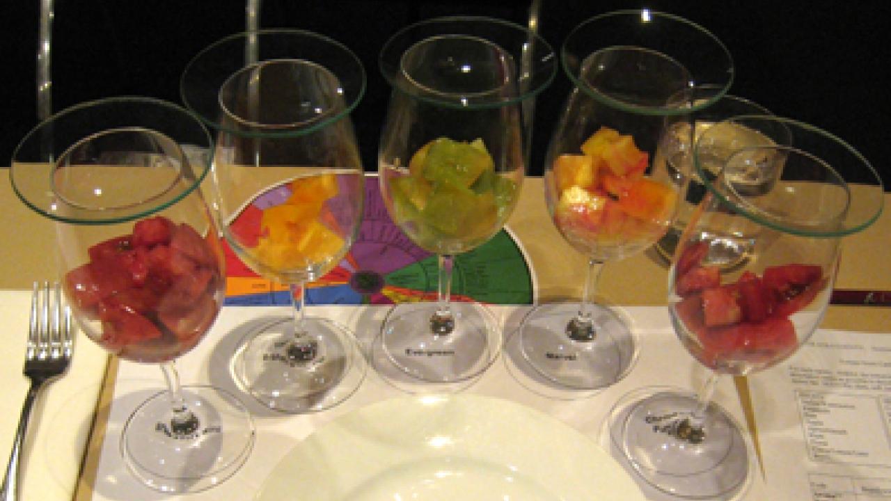 Heirloom tomatoes in wine glasses: brandywine, yellow brandywine, evergreen, marvel and cherokee purple.