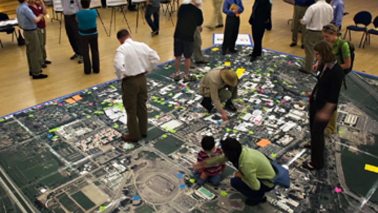 Planners invited students, staff and community members to walk on a giant map to show&mdash;with Post-it notes&mdash;what people liked or did not like about the campus bikeway network, from paths and parking to traffic circles and signs.