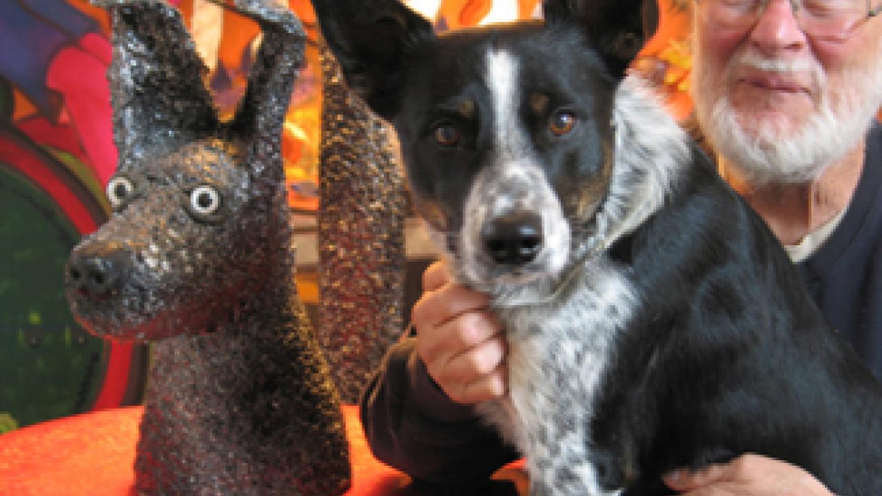 Cato, the dog pictured here with Roy De Forest, is expected to be at the Nov. 13 tribute to the artist.