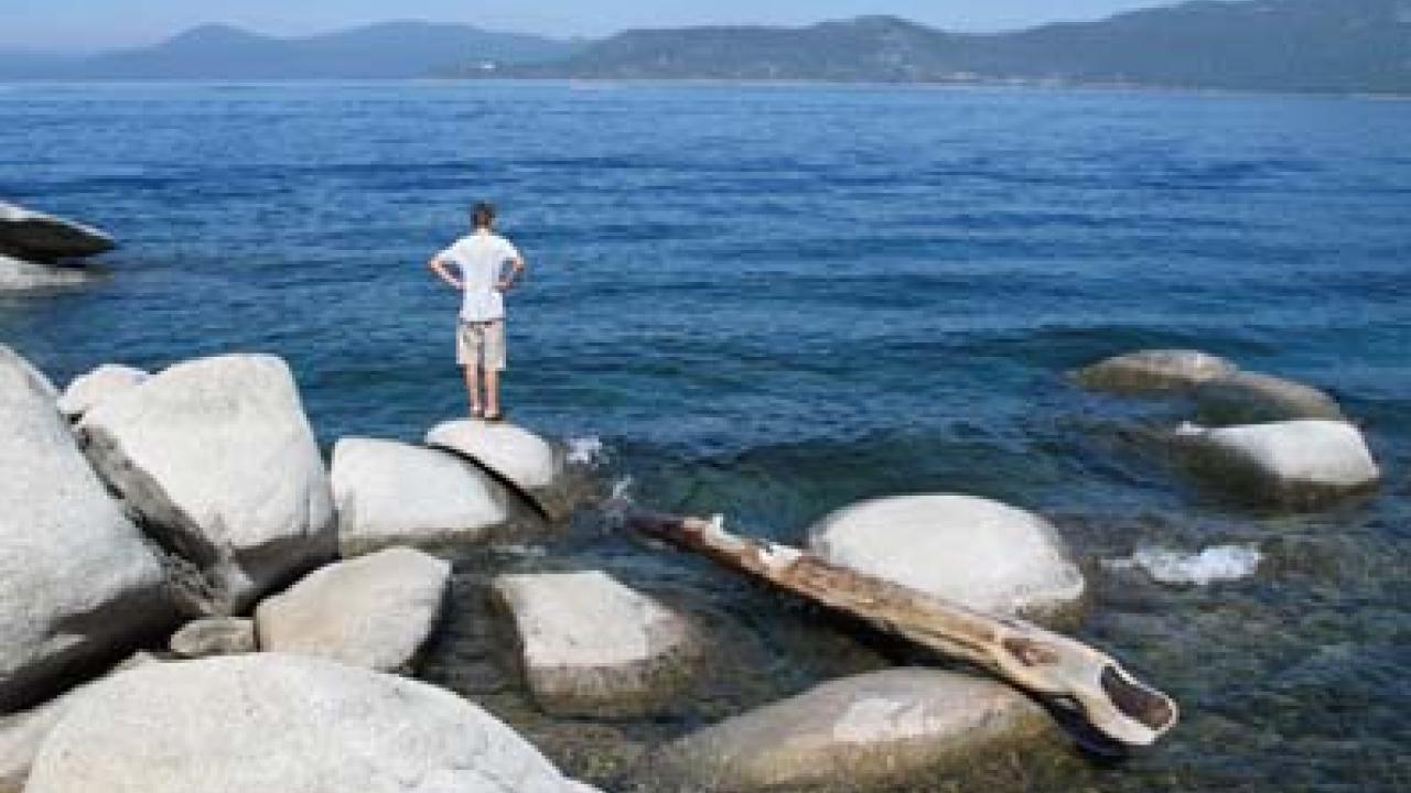 Visitors like this young man, pictured on the Nevada side of Lake Tahoe, saw clear water to an average depth of 69.6 feet last year.