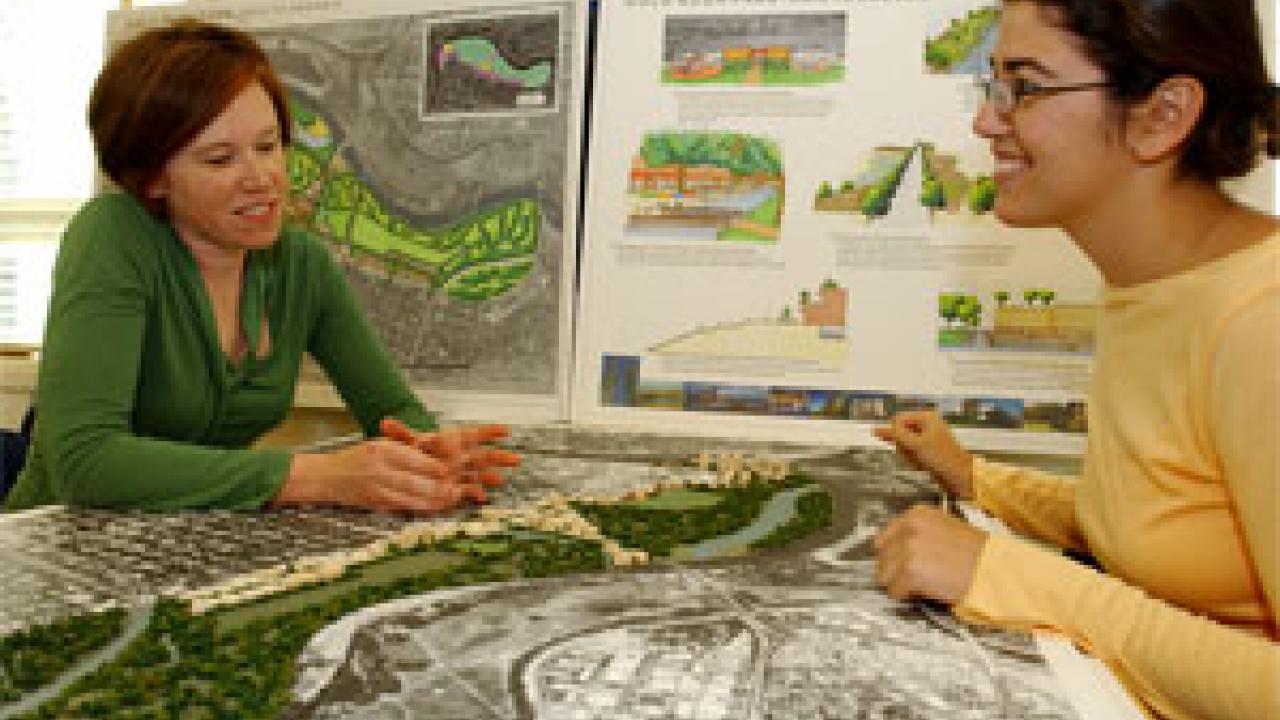 Landscape architect students Jennifer Egawa, left, and Julia Cox talk about their proposed plan for a park, bigger than New York&rsquo;s Central Park, along Sacramento&rsquo;s American River.