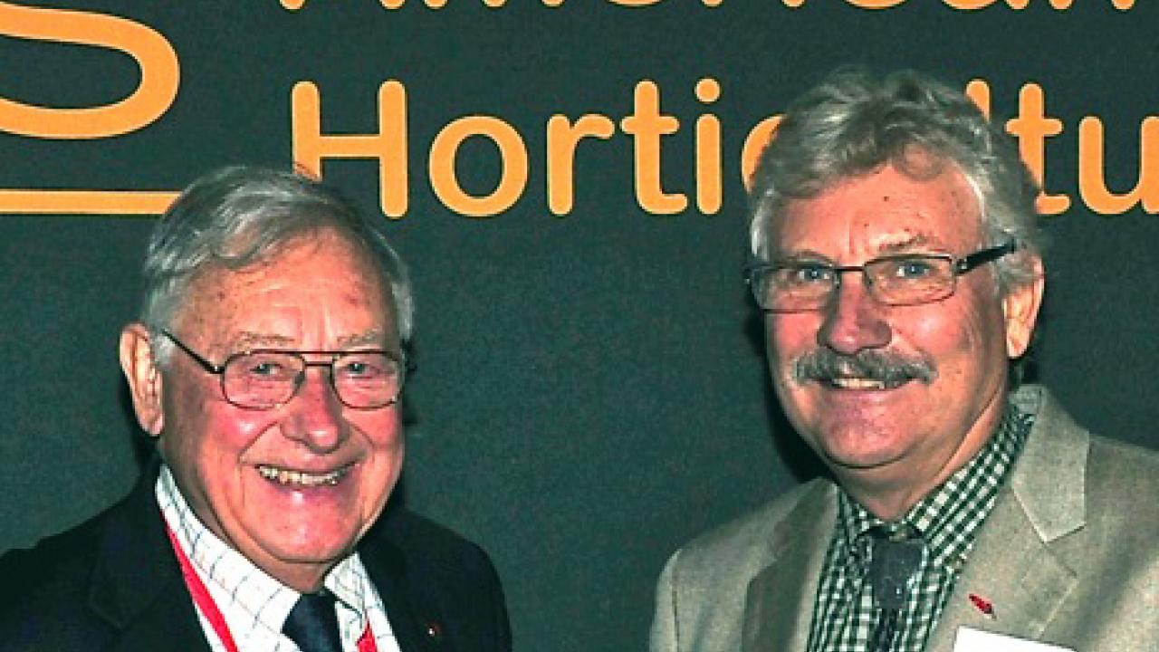 Photo: Hall of Famer Charley Hess, left, at his induction ceremony with Paul Bosland, president of the American Society for Horticultural Science. 