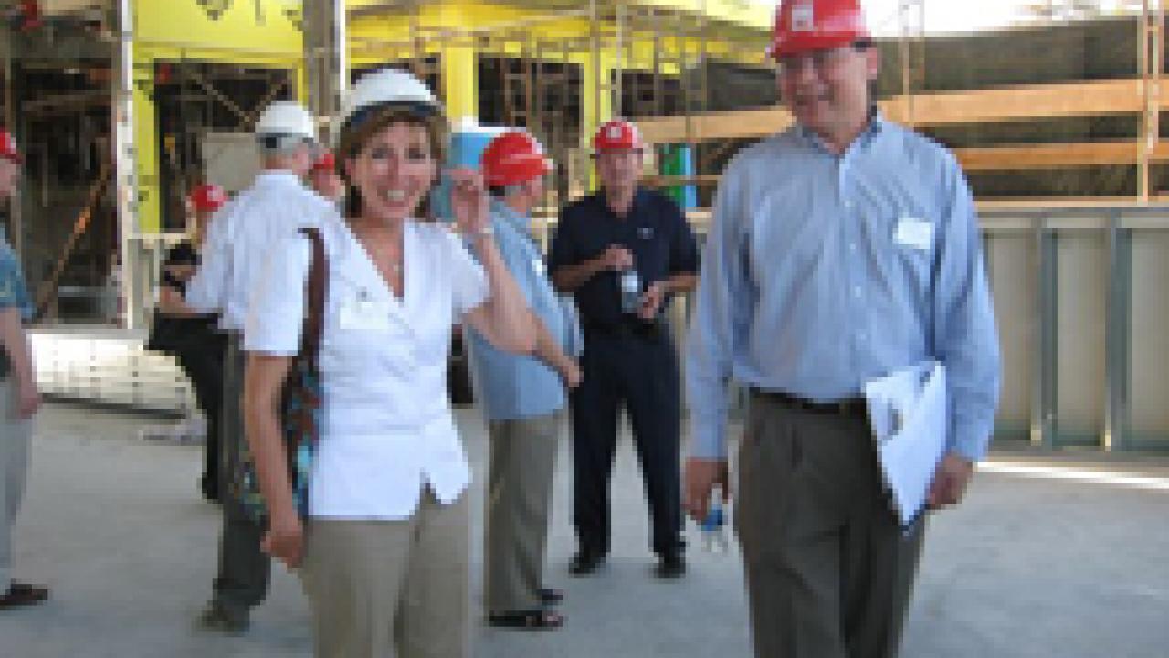 Dean Kevin Johnson, right, leads Chancellor Linda Katehi on a construction tour at the law school, where a $30 million expansion and renovation project is under way. The tour took place Aug. 16 after Katehi met with the law school alumni board a