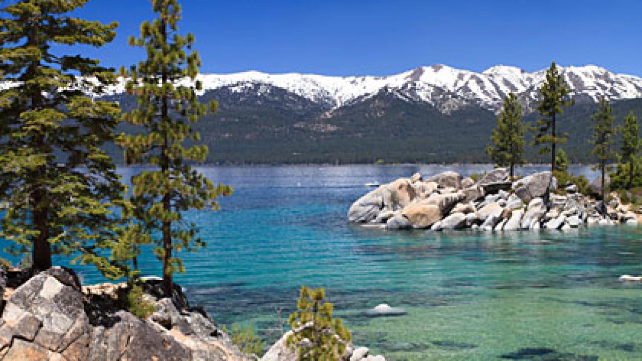 View of Lake Tahoe with snowy mountains in background