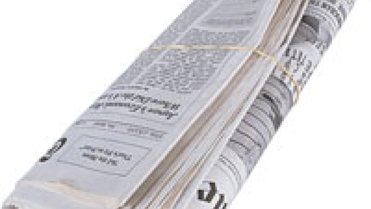Photo: rolled newspaper