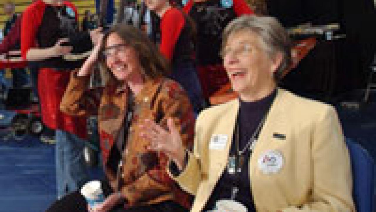 Provost Virginia Hinshaw, right, enjoys the FIRST Robotics Competition excitement with Karen McDonald, associate dean in the College of Engineering.