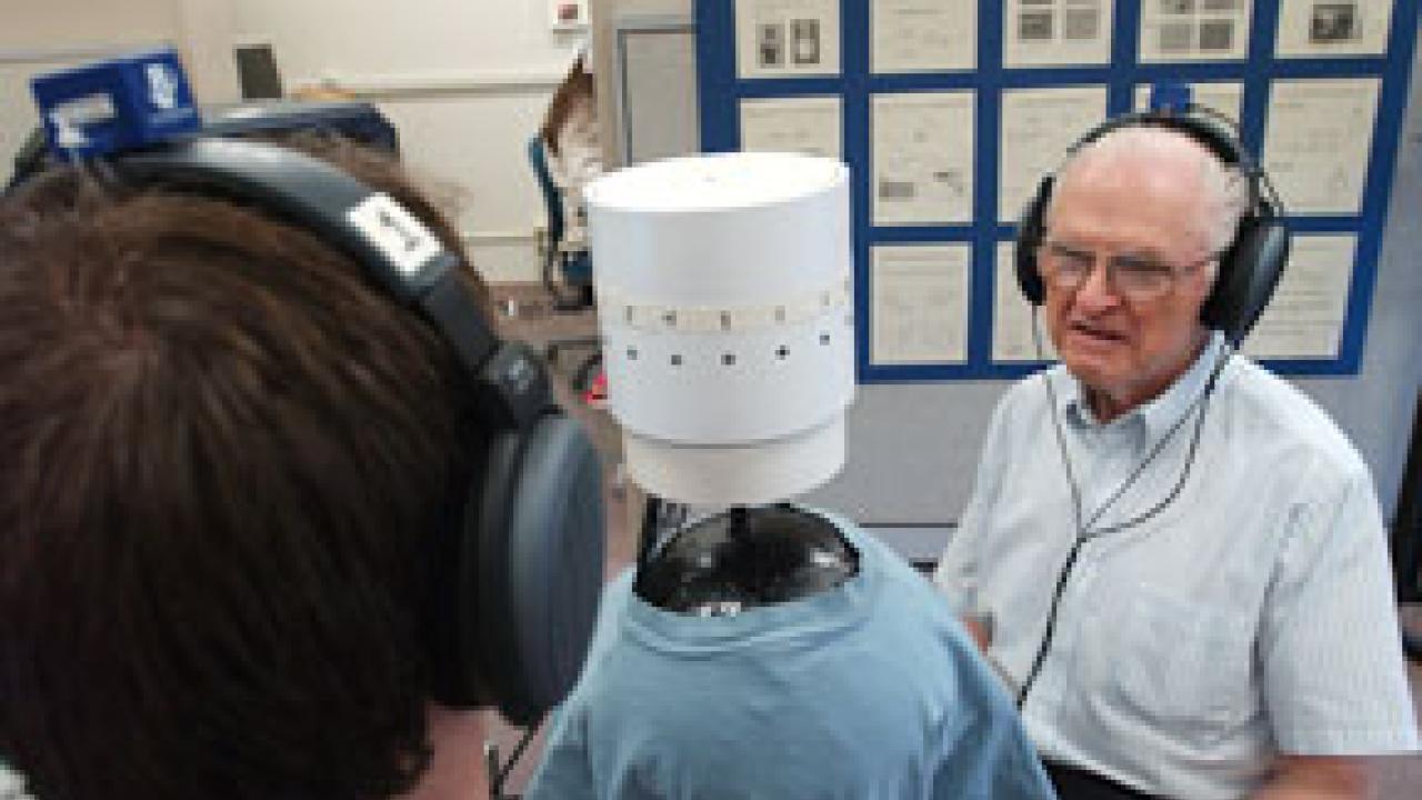 UC Davis graduate student Bob Dalton, left, tries out the sound studio as researcher Ralph Algazi, a co-developer of motion-tracked binaural sound, looks on.