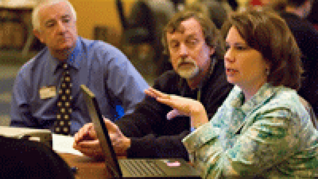 Diane Davies-Conley, right, chief operating officer in the Office of Resource Management and Planning,  talks about energy conservation at the March 21 budget forum as staff members Ward Stewart, middle, and Phil Knox, listen to the discussion. 