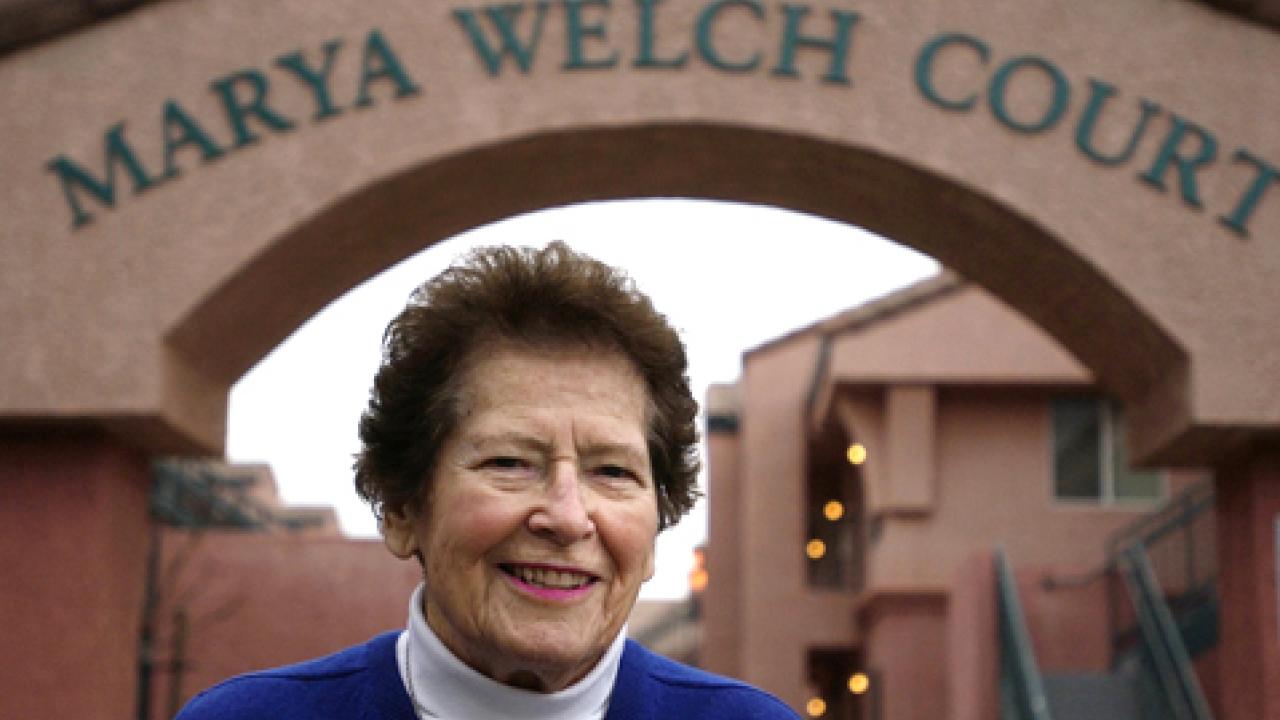 Photo: Marya Welch, photographed in 2005 at The Colleges at La Rue student housing complex, under the "Marya Welch Court" sign.