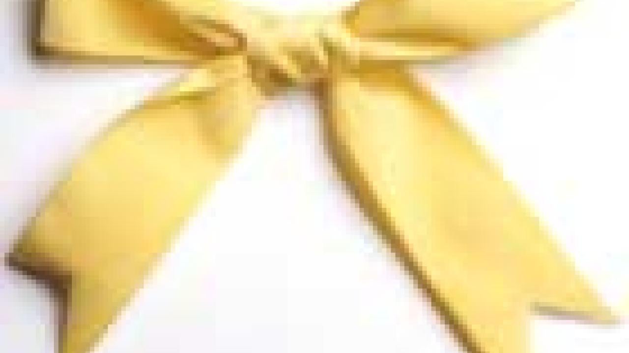Photo: yellow ribbon tied in a bow