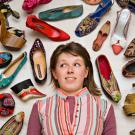 Student Nora Cary surrounded by footwear from around the world, as photographed by Karin Higgins