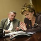Linda Katehi speaks with reporters by telephone on May 7. Her husband, Spyros Tseregounis, is seated next to her.