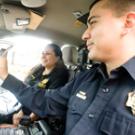 UC Davis police cars are now equipped with computers, shown here by Jason Barrera, the department's officer of the year for 2009; and Leticia Garcia-Hernandez, employee of the year. Garcia Hernandez, dispatch supervisor, played a key role in get