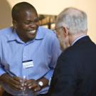 Peter Mutinda Mutua of Kenya shares a laugh with William Lacy, Vice Provost of University Outreach and International Programs, at a Feb. 3 Chancellor's Reception for the Humphrey and Fulbright fellows.