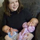 Katherine Florey, assistant professor of law, and twins, Sean and Miranda, photographed March 18 at the age of 2 weeks.