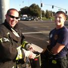 Photo: UC Davis firefighters Shawn Cullen and Kyle Dubs are all smiles at the successful Fill the Boot for Burns fundraiser Feb. 17.