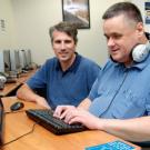 Photo: Tim Leamy, computer lab manager for Academic Technology Services, and Russ Zochowski, disability specialist at the Student Disability Center.
