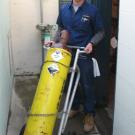 Swimming pool operator Kirk Schaake carts off one of the last chlorine gas tanks from Hickey Pool on Feb. 7.