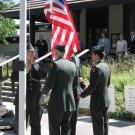 UC Davis Army ROTC color guard raises the Stars and Stripes at the Memorial Day observance at Davis Cemetery.