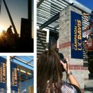 Photos (3): Worker in a cherry picker raises a new banner; two of the banners in place; and a news photographer shooting a banner installation.