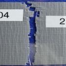 The open seam between two pieces of duct tape, the pieces having formerly been attached, to show how the pieces might be reliably matched.