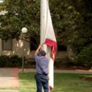 Joe Juarez of  Operations & Maintenance prepares to raise the California flag to half-staff Tuesday in memory of those killed in the Virginia Tech massacre. UC Davis joined other institutions nationwide in this act of remembrance, and will hold 