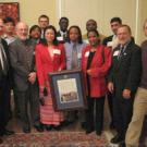Humphrey Fellow program participants and coordinators present a commemorative version of their Principles of Community to Chancellor Larry Vanderhoef, left, and Vice Provost for University Outreach and International Programs Bill Lacy on Jan. 24