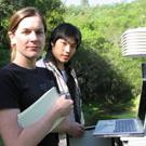 Computer science graduate students Stephanie Liese and Daniel Wu test a wireless communications network that connects a wildland research site to the Internet.
