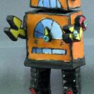 A raku-fired ceramic robot by Kasha Maslowski, from her show titled Whilst Dreaming I at the Craft Center Gallery.