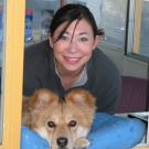 Student employee Jennifer Cheng and her dog, Keira, at the North Gate Kiosk.