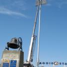 A crane lowers one of the light poles into place on May 29 at Aggie Stadium, where the Tavernetti Bell greets fans entering from the east.