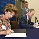 Photo: Chancellor Linda P.B. Katehi and LBNL Director Paul Alivisatos sign a memorandum of understanding for research collaboration.