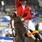 Gina Miles takes a victory lap aboard McKinlaigh after they win an Olympic silver medal in individual eventing in Hong Kong.