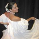 Photo: Monica Bosque dances during last year's Serenata Colombiana