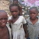 Children next to a pink pond in Shada, Haiti.
