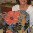 Entomologist Diane Ullman holds one of the ceramic tiles that she made for Nature&rsquo;s Gallery, a UC Davis mosaic mural that went on display last year in the U.S. Botanic Garden in Washington, D.C.  The project was part of the Art-Science Fusion 