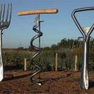 Photo: a giant-sized fork, corkscrew and bottle opener 
