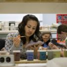 Student Thu Nguyen paints a Jerusalem cricket on ceramic tile for the Nature&rsquo;s Gallery exhibit.